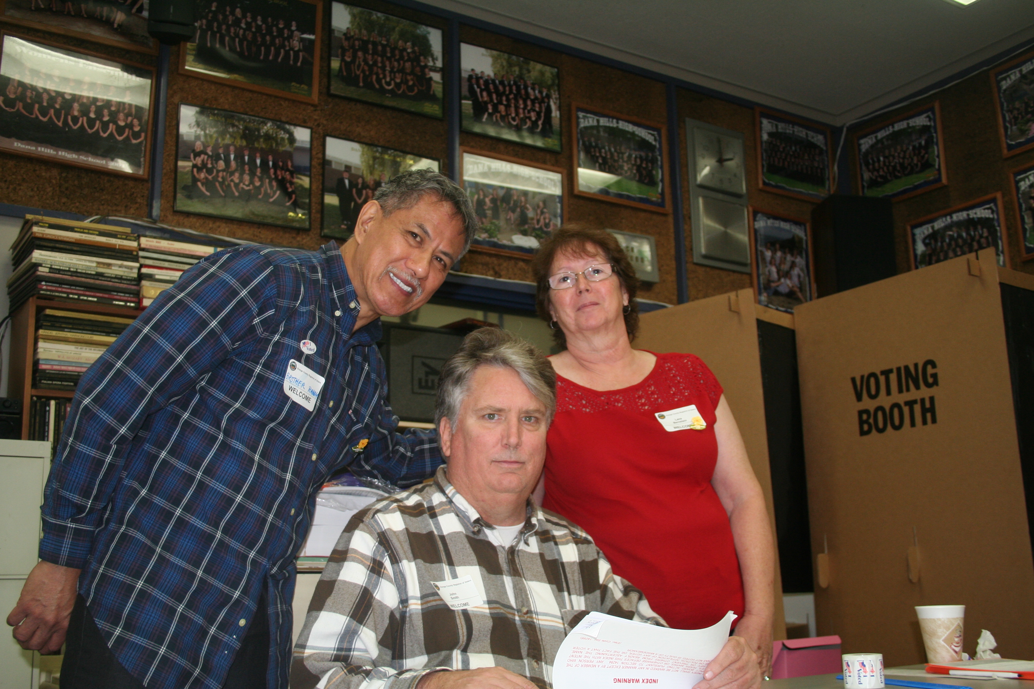 Randy DeGuzman, on the left, volunteering as a poll inspector
